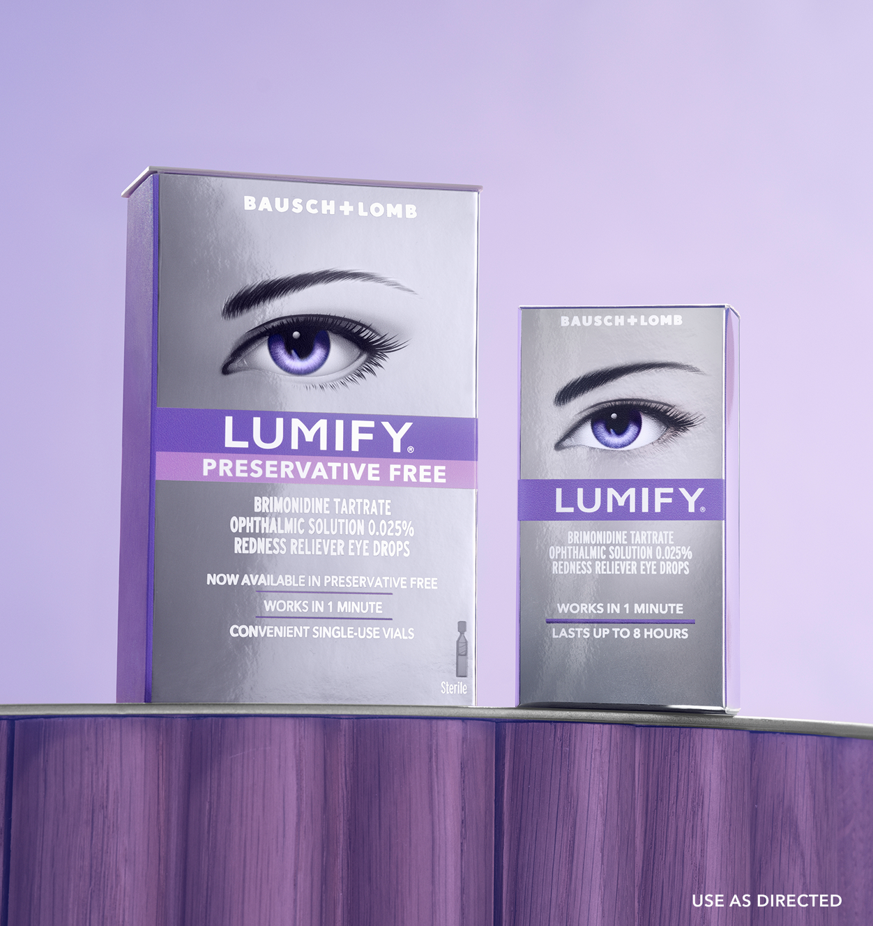Pair of hands holding up a box of Lumify redness reliever eye drops